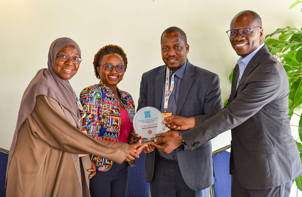 Bayero University Vice Chancellor Prof Haruna Musa (Middle) and Deputy Vice Chancellor Prof Amina Mustafa (Left) presenting the university plaque to the icipe team led by the head of Policy and Enabling Environment, Dr Julius Ecuru (Right), and Dr Everlyne Nguku (second left) when they visited the Duduville campus yesterday.